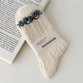 Cream knit socks with dark green ruffled edges and ribbed texture in soft minimalist style - Cheese