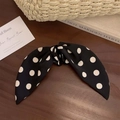Elegant black hair claw clip with white polka dot pattern and satin ribbon bow design - Black Polka Dot Ponytail Claw