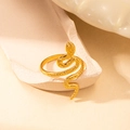 Detailed view of a gold-toned snake ring with intricate textures on textured plaster stone - Detailed Snake Style (BJGR0132)