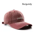 Vintage burgundy denim baseball cap with white Conquer embroidery and washed cotton texture - Burgundy