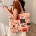 Large beige canvas tote bag featuring cute cartoon animal illustrations and shoulder straps - Kitten Grilled Fish (Pink Strap)
