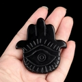 Hamsa Hand carving in natural black obsidian stone with engraved eye and light rays - Obsidian