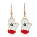 Detailed view of Christmas glove earrings featuring red cuffs and golden snowflake patterns - Glove #34