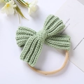 Close-up of soft knitted mint green bow nylon headband with high elasticity for infants - Emerald Green