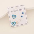 Detail of three pairs of stainless steel earrings with evil eye and blue heart studs - Blue Heart Style (1#)