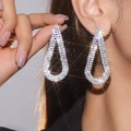 Elegant silver teardrop earrings with sparkling white crystals for a luxury fashion look - Silver Hollow Waterdrop Full Rhinestone Style (LDE6001S-W)