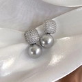 Detail of square pavé zircon stud earrings with elegant dangling grey pearls on silk - Silver Gray Pearl