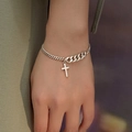 Silver chain bracelet with cross pendant featuring asymmetrical curb and fine link design - Cross Bracelet