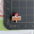 Miniature resin Christmas sign post with red hat and scale ruler for size reference - 17-Christmas Signboard