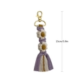 Handmade daisy macrame keychain with purple and yellow tassels, length 15cm - Purple White