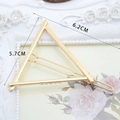 Golden alloy triangular hair clip with polished finish and size dimensions in 6.2cm - Triangle Shape Gold