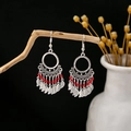 Bohemian silver earrings with red beads and leaf pendants on a wooden display - E4980 Red Leaf Dangle