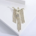 Elegant gold-tone human shape brooch with dangling tassels and sparkling rhinestones - Tassel Humanoid / Gold