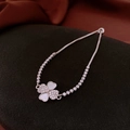 Macro detail of silver four-leaf clover bracelet with white shell inlay and crystals - Silver - Shell Inlaid Diamond Clover
