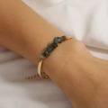 Close-up of a vintage chain bracelet with natural green crushed stones on a woman's wrist - Agate Gravel (Bar Style)