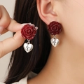 Deep red rose earrings with silver heart cross charms shown on a model - Dark Red Rose Cross