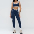 Navy blue yoga set with contrast piping and cross-waist leggings on a model - S / Square Neck Bra & Leggings Set / Navy Blue