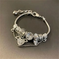 Silver snake chain bracelet with crystal heart and tassel charms in polished finish - Wing Chain Bracelet