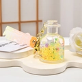 Yellow star liquid quicksand milk bottle keychain with pink gradient Bubble hand strap - Bottle Decor / Yellow