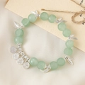 Green crystal beaded bracelet with silver leaf and peace pendants in a variant style - Peaceful Joy Ice Mist Green (K3580)