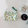 Detailed close-up of a floral cotton mini pouch with fruit pattern and woven rope zip pull - Green Leaves Loquat