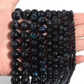 Detailed view of natural blue tiger eye loose beads in various sizes from 6mm to 14mm - Dark Blue Tiger Eye