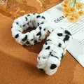 Soft plush spa wristbands featuring black and white cow print patterns for skincare - Cow Print Wristband 2-Piece Set (25#)