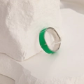 Detail view of silver ring with green enamel square sections on a white stone base - Adjustable Open / Silver Green