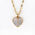 Macro detail of a heart-shaped shell pendant with sparkling zircon in gold finish - Heart Spliced Zircon Row Style (Style 8 Gold) / Gold