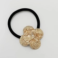 Elastic hair tie with gold textured clover charm on clean white background - Matte Rose Gold - Clover