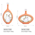 Modern orange ceramic vase set with white and gold elk statues inside an oval cutout - Life Together Set / Metallic Orange