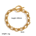 Macro shot of 18k gold plated 304 stainless steel chain bracelet with OT toggle clasp - Gold Slim OT Clasp Bracelet Style (TB5140)