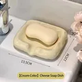 Portasapone in ceramica a forma di formaggio, color crema, con texture realistica - Formaggio / crema
