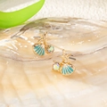 Macro shot of asymmetric gold earrings with turquoise enamel shell and starfish details - Turquoise Shell Starfish (YLC-ES-212)