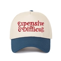Close-up of red Expensive & Difficult embroidery on a two-tone cotton baseball cap - Off-white/Deep Blue