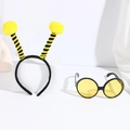 Detail of bee costume set featuring yellow pom-pom headband and honeycomb pattern glasses - No.1 Yellow Ball Bee Headband + Yellow Glasses