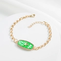 Detail of 18K gold plated Cuban chain bracelet with green enamel zodiac charm - Gemini