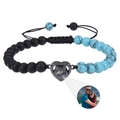 Detail of tiger eye stone heart pendant with custom photo projection and adjustable cord - Turquoise + Matte Stone Bracelet