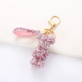 Detail of pink rhinestone bear keychain with glittering gradient crystals and golden clasp - Mixed Pink