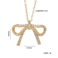 Golden bow pendant necklace with cubic zirconia, length 40+5cm, weight 4g measurements - Bow-knot Gold Style (888)