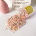 Colorful disposable hair elastics in a transparent jar with natural pastel tones - Thin Cream Pink Series (Approx. 1500 Pcs)
