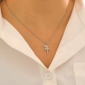 Elegant double layered stainless steel cross necklace with cubic zirconia on a model - Double Layer Pave Cross Necklace (3638) / Silver