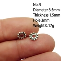 Detail view of a 6.5mm silver alloy spacer bead for DIY jewelry making on white background - 9# (Dia 6.5mm Thick 1.5mm)
