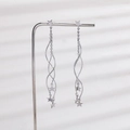 Elegant long silver tassel earrings with hollow star charms on a metal stand - White Gold Star Wave Earrings