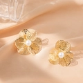 Golden hollow flower earrings with central white pearls on elegant silk background - Flower 3