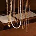 Golden multi-layer chain set with pearls and padlock pendant on dark wood display - Pearl Chain Set NC1007G / 40+5cm