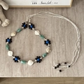 Detail of bohemian handmade belt with wooden flower beads and white shell accents - Blue Core Black Flower Green Bead - 185cm