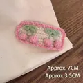 Macro shot of handmade crochet cherry hair clip with pink wave lace and measurements - Pink Cherry Hair Clip