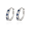 Silver huggie earrings with alternating blue and white crystals and geometric cutout sides - White Gold Plated Copper / Aquamarine Blue
