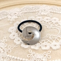 Minimalist black elastic hair tie with a decorative silver spiral metal buckle - Silver Swirl